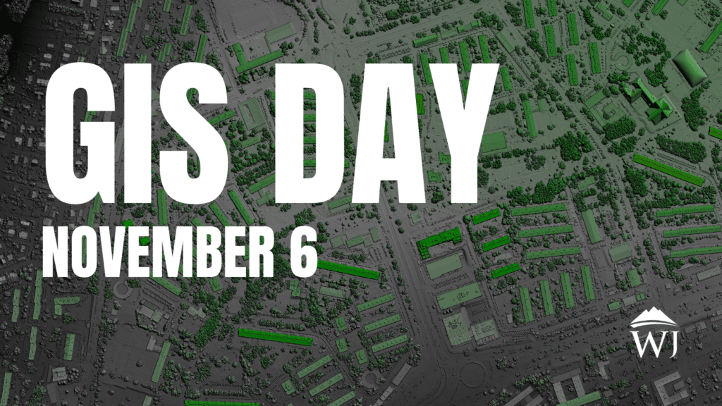 Text overlay on a grayscale aerial map with some buildings highlighted in green reads GIS Day November 6. In the bottom right corner, theres a logo with the initials WJ.