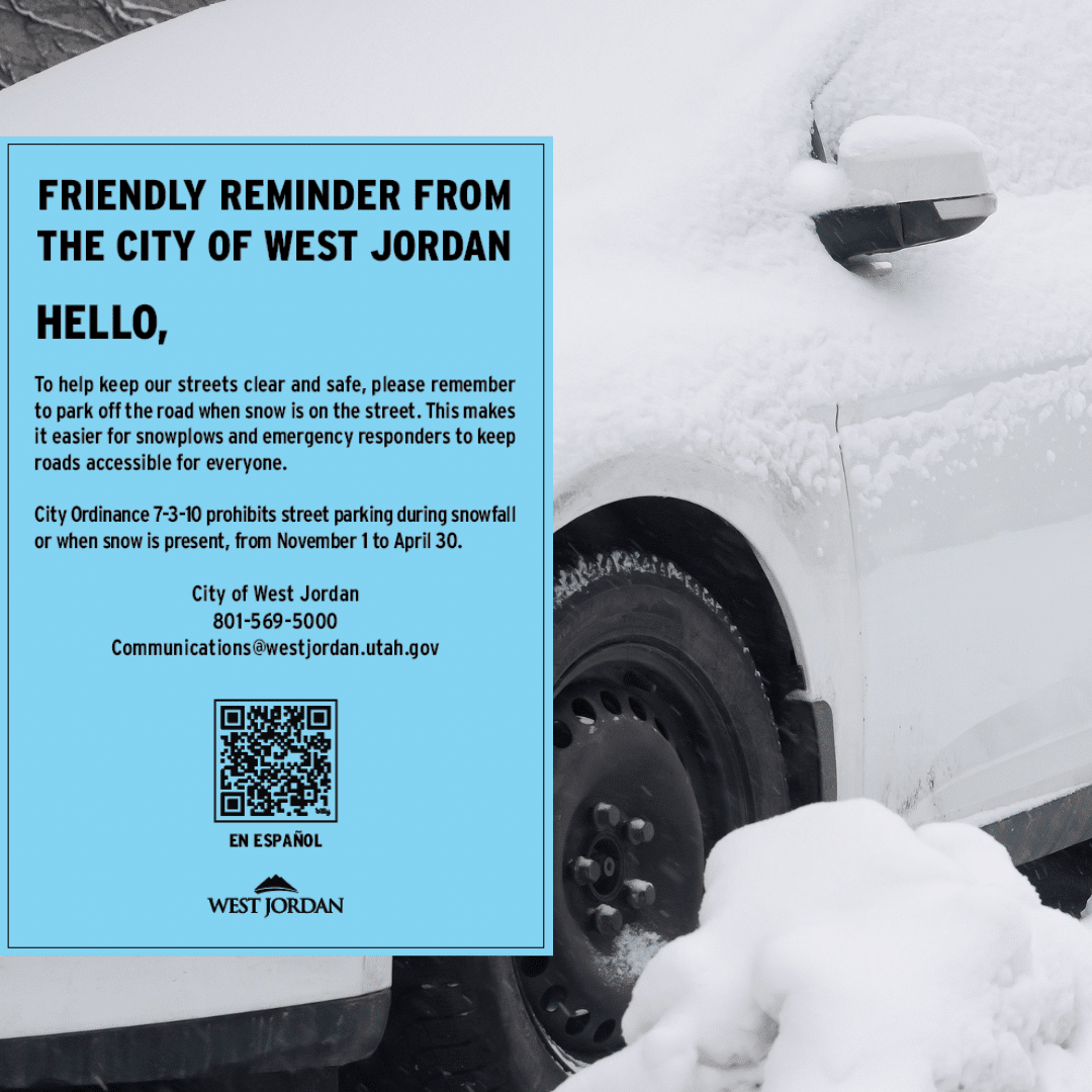 A parked white car covered in snow. A blue notice from the City of West Jordan is placed on the windshield, reminding residents about snow removal and parking restrictions from November 1 to April 30. Includes a QR code for more information.