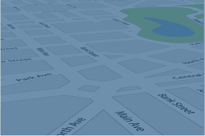 A digital map illustration showing a grid of blue streets and labeled avenues, such as Main Ave and Park Ave. There is a green park area with a blue pond on the upper right.